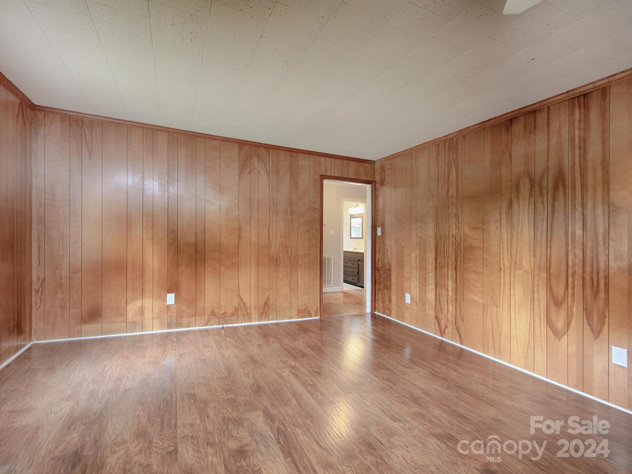 446 Fieldstone Road Mooresville, NC 28115 - Photo 13 of 30 a view of an empty room with wooden floor