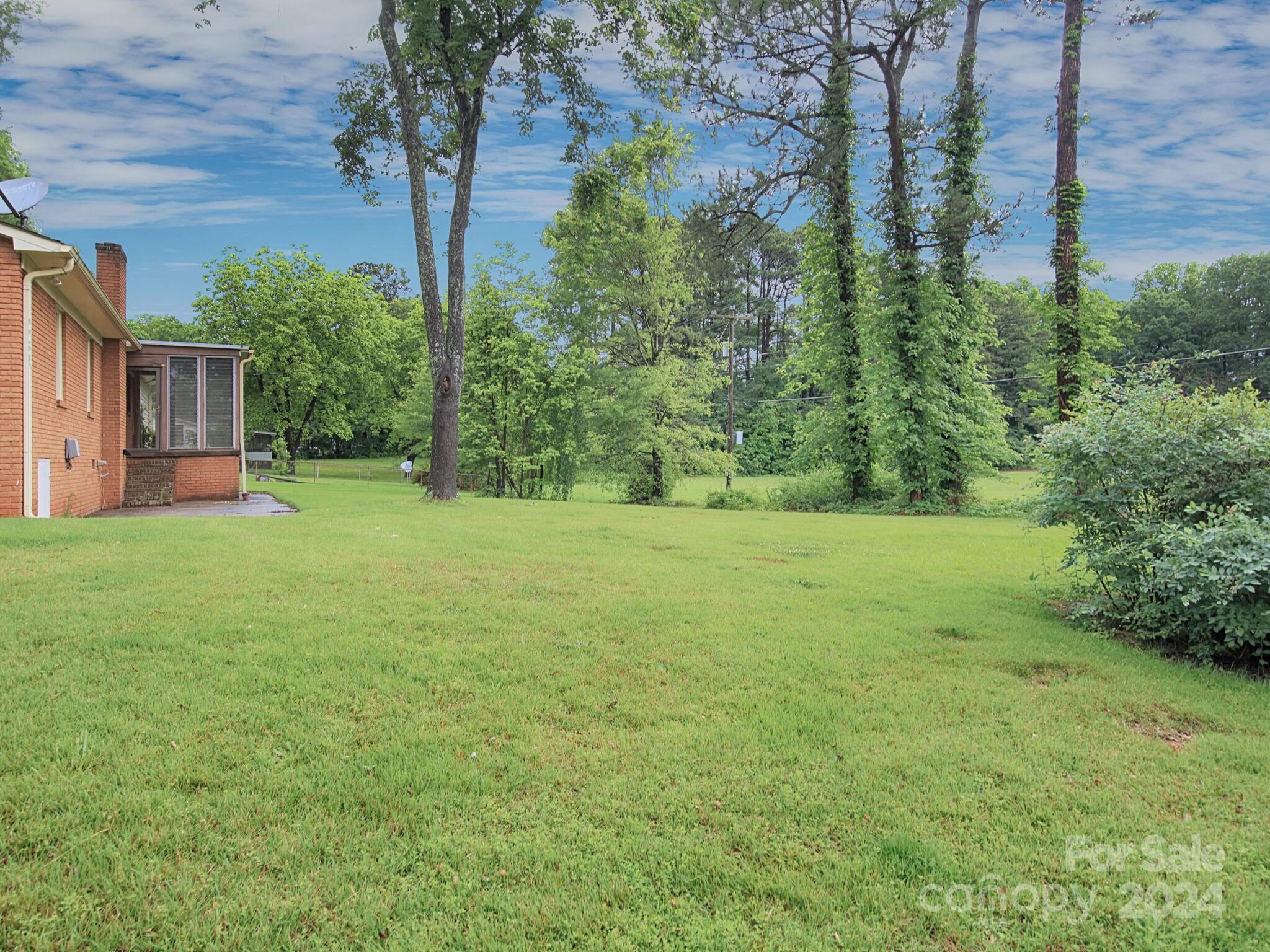 446 Fieldstone Road Mooresville, NC 28115 - Photo 25 of 30 a view of a yard with a house in the background