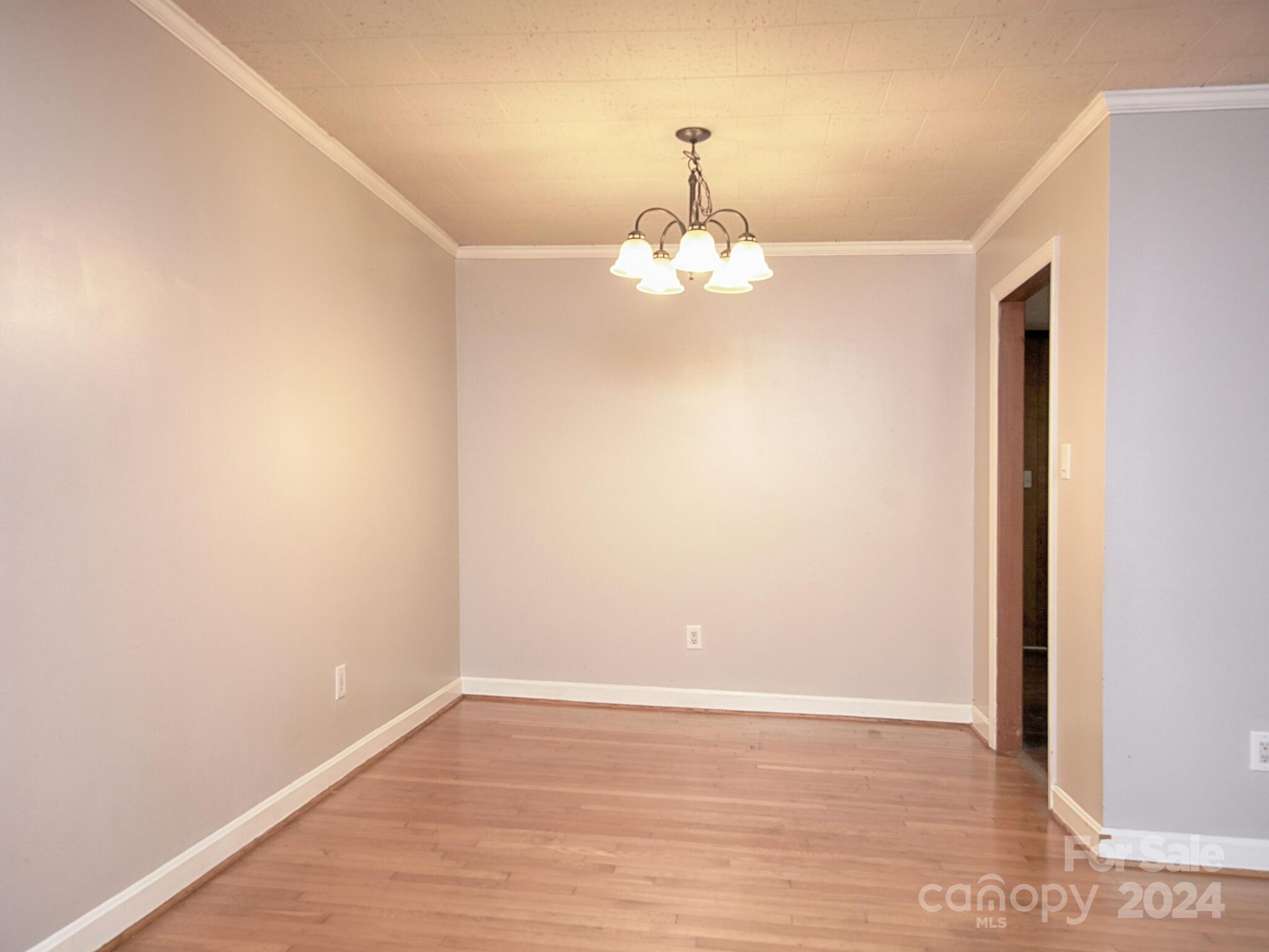 446 Fieldstone Road Mooresville, NC 28115 - Photo 9 of 30 a view of an empty room with wooden floor
