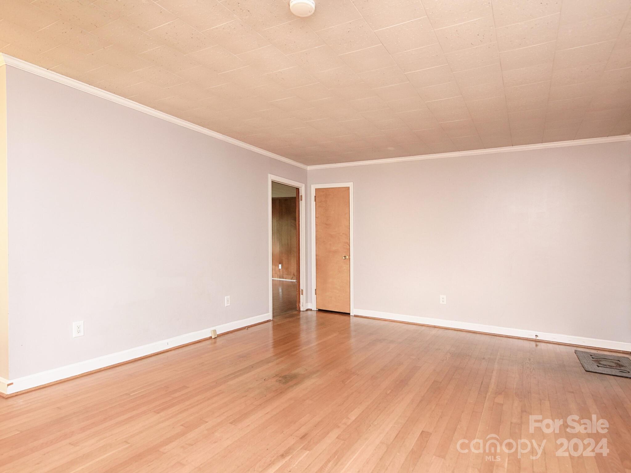 446 Fieldstone Road Mooresville, NC 28115 - Photo 10 of 30 a view of an empty room with wooden floor