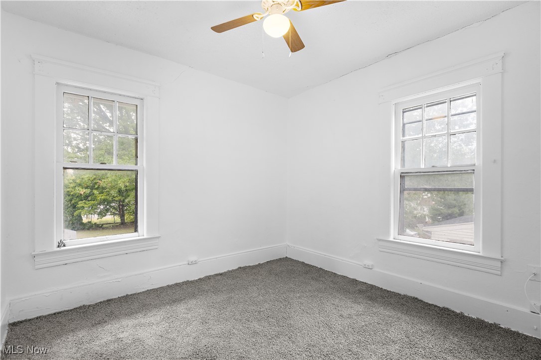 324 Root Road Lorain, OH 44052 - Photo 15 of 38 Carpeted empty room with ceiling fan and a wealth of natural light