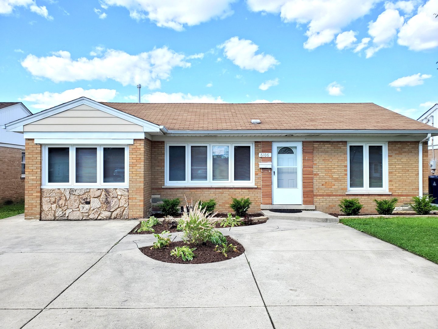 6106 Birmingham Street Chicago Ridge, IL 60415 - Photo 1 of 31 a front view of a house with garden
