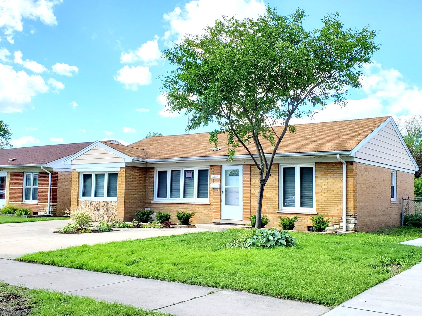 6106 Birmingham Street Chicago Ridge, IL 60415 - Photo 2 of 31 a front view of a house with a garden