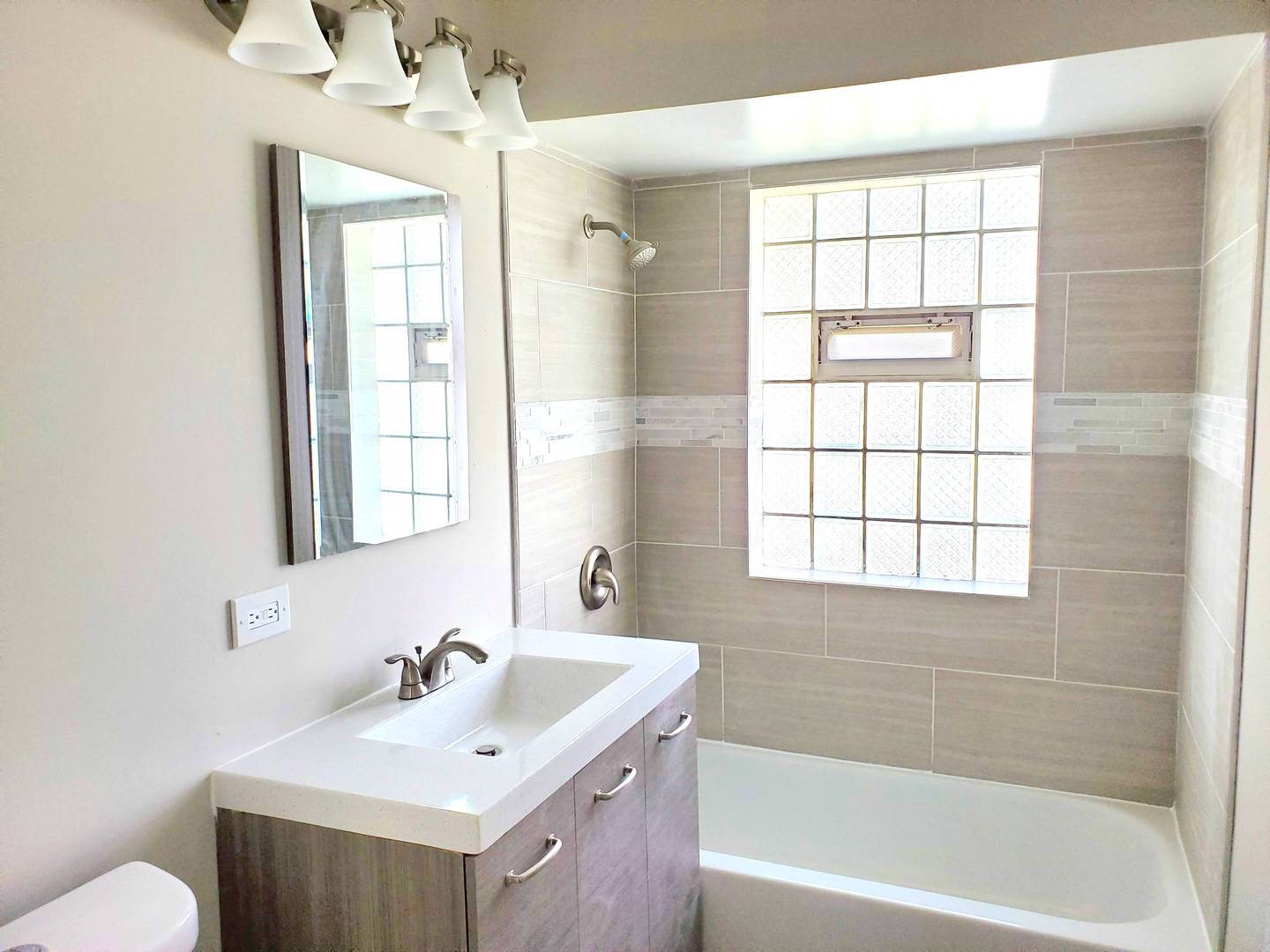 6106 Birmingham Street Chicago Ridge, IL 60415 - Photo 13 of 31 a bathroom with a tub sink toilet and mirror