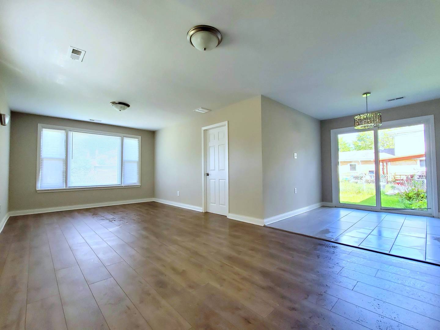 6106 Birmingham Street Chicago Ridge, IL 60415 - Photo 14 of 31 an empty room with wooden floor and windows