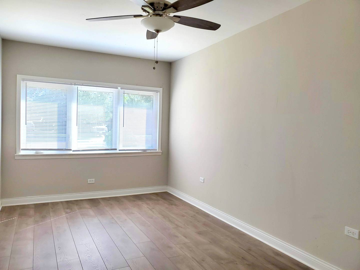 6106 Birmingham Street Chicago Ridge, IL 60415 - Photo 18 of 31 wooden floor in an empty room with a window