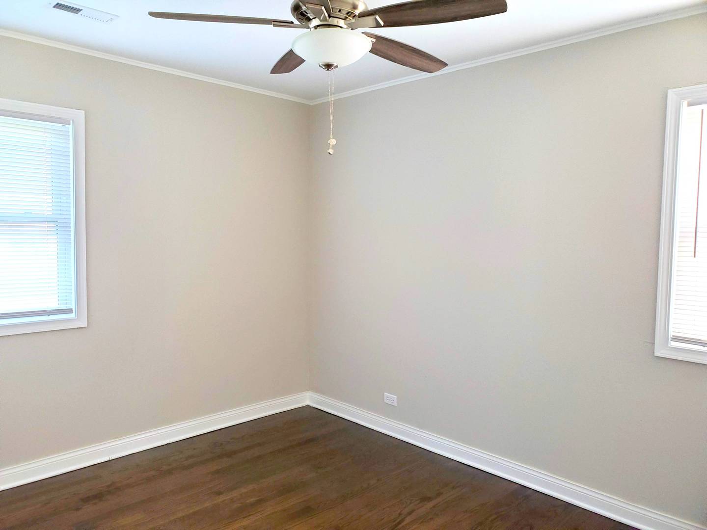 6106 Birmingham Street Chicago Ridge, IL 60415 - Photo 19 of 31 an empty room with wooden floor and windows