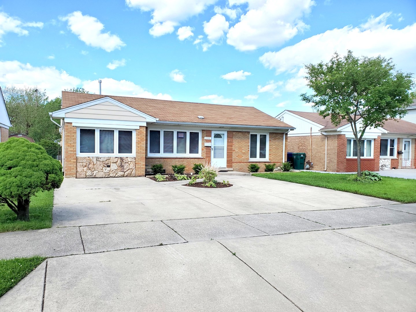 6106 Birmingham Street Chicago Ridge, IL 60415 - Photo 3 of 31 a front view of a house with a garden and trees