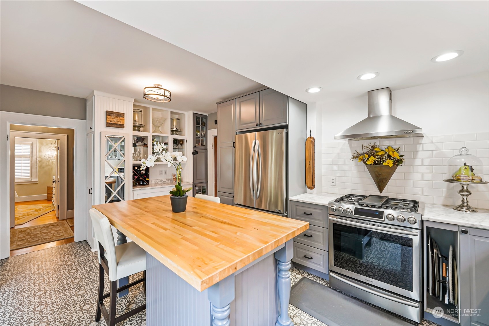 5918 Sunset Avenue Anacortes, WA 98221 - Photo 14 of 38 a kitchen with stainless steel appliances kitchen island a stove and a refrigerator