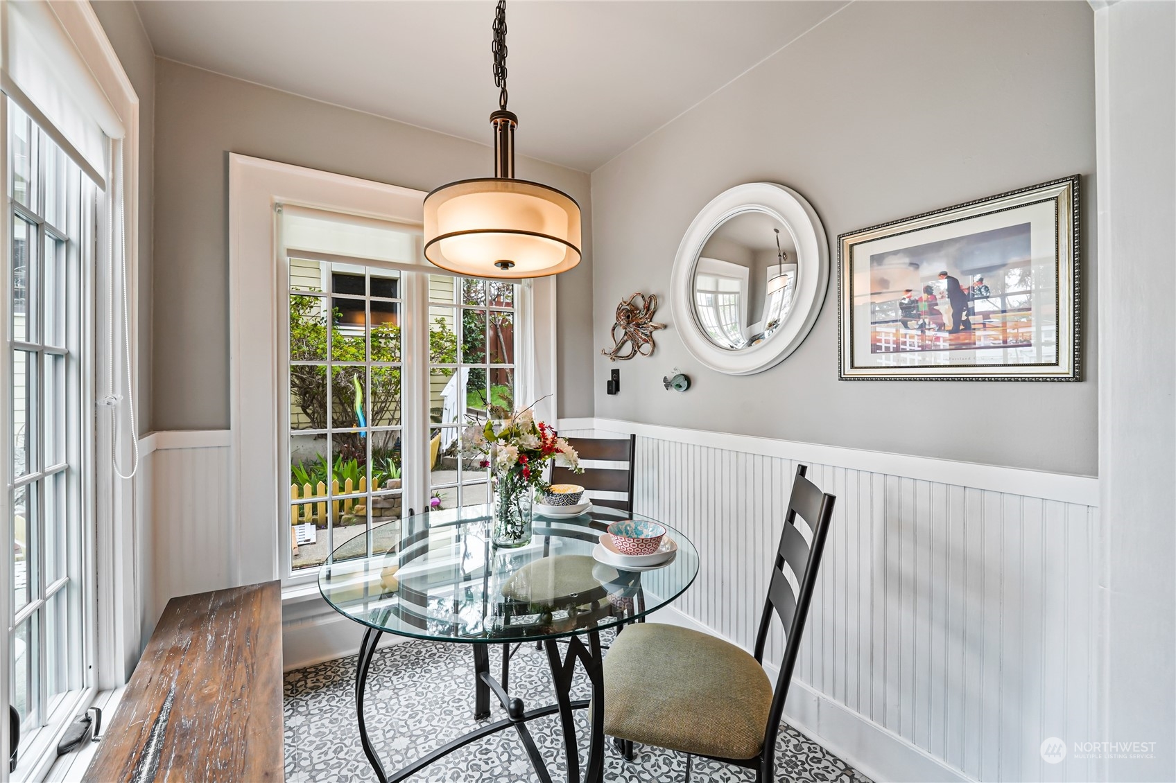 5918 Sunset Avenue Anacortes, WA 98221 - Photo 17 of 38 a view of a dining room with furniture wooden floor and chandelier