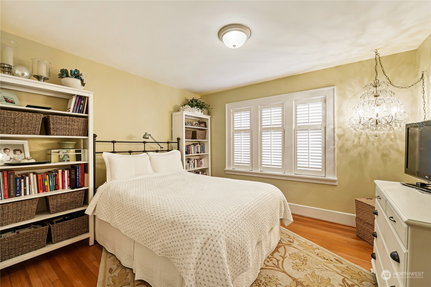 5918 Sunset Avenue Anacortes, WA 98221 - Photo 18 of 38 a bedroom with a bed next to a window with a flat screen tv