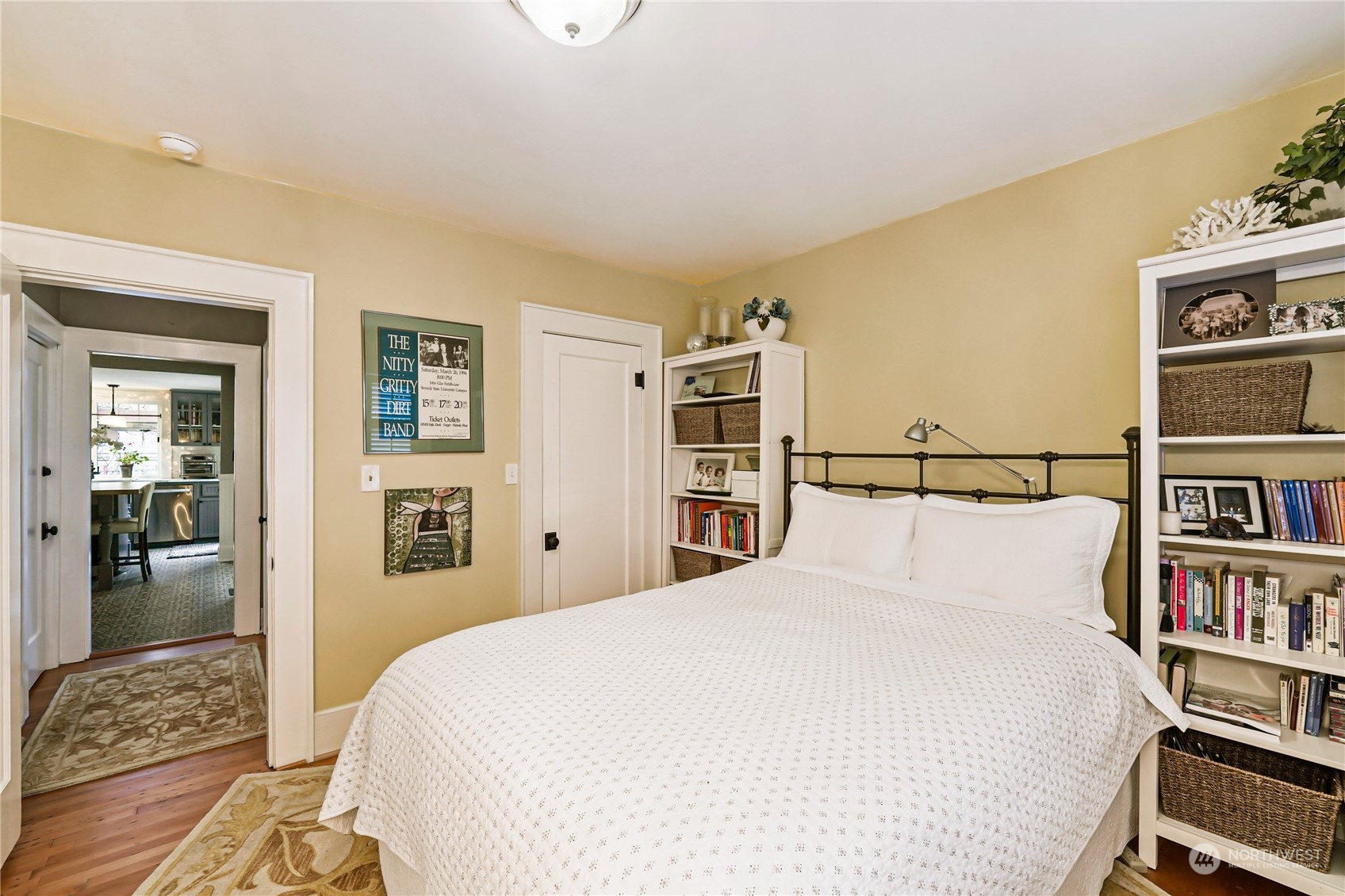 5918 Sunset Avenue Anacortes, WA 98221 - Photo 19 of 38 a bedroom with a bed a dresser and book shelf