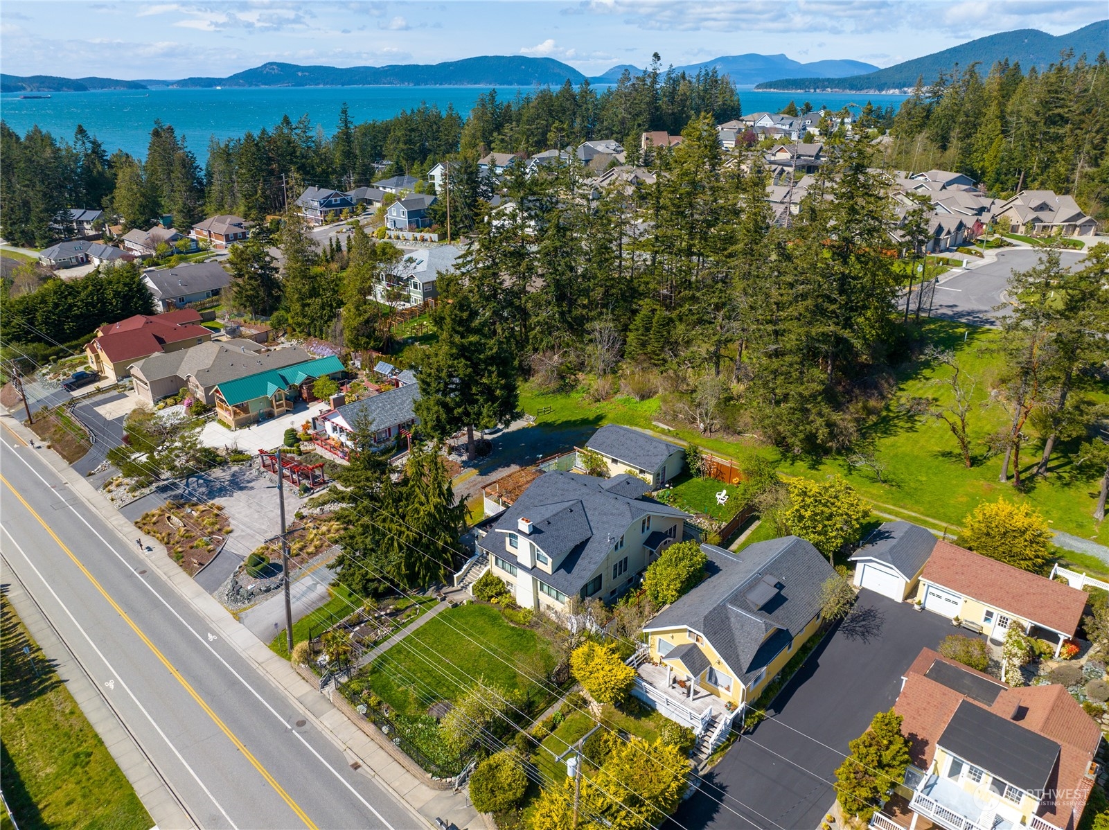5918 Sunset Avenue Anacortes, WA 98221 - Photo 2 of 38 an aerial view of residential houses with outdoor space