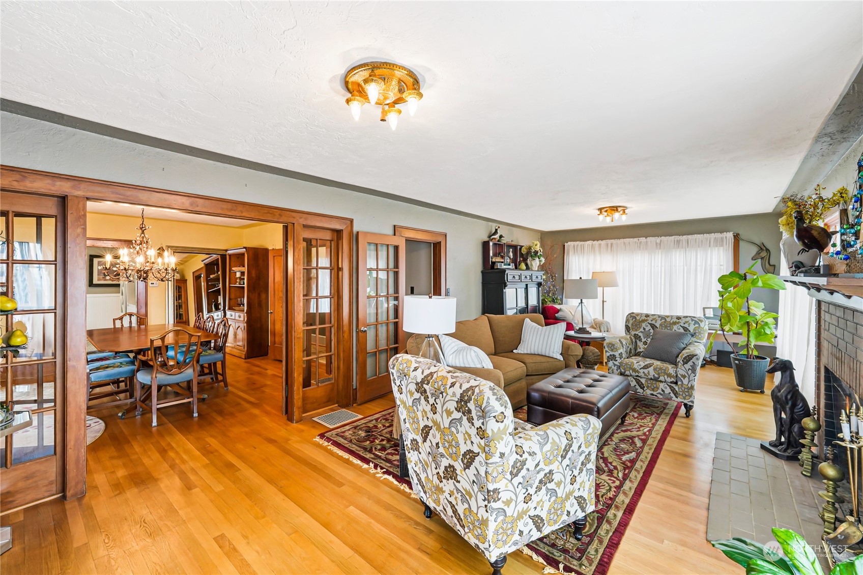 5918 Sunset Avenue Anacortes, WA 98221 - Photo 3 of 38 a living room with furniture and a floor to ceiling window
