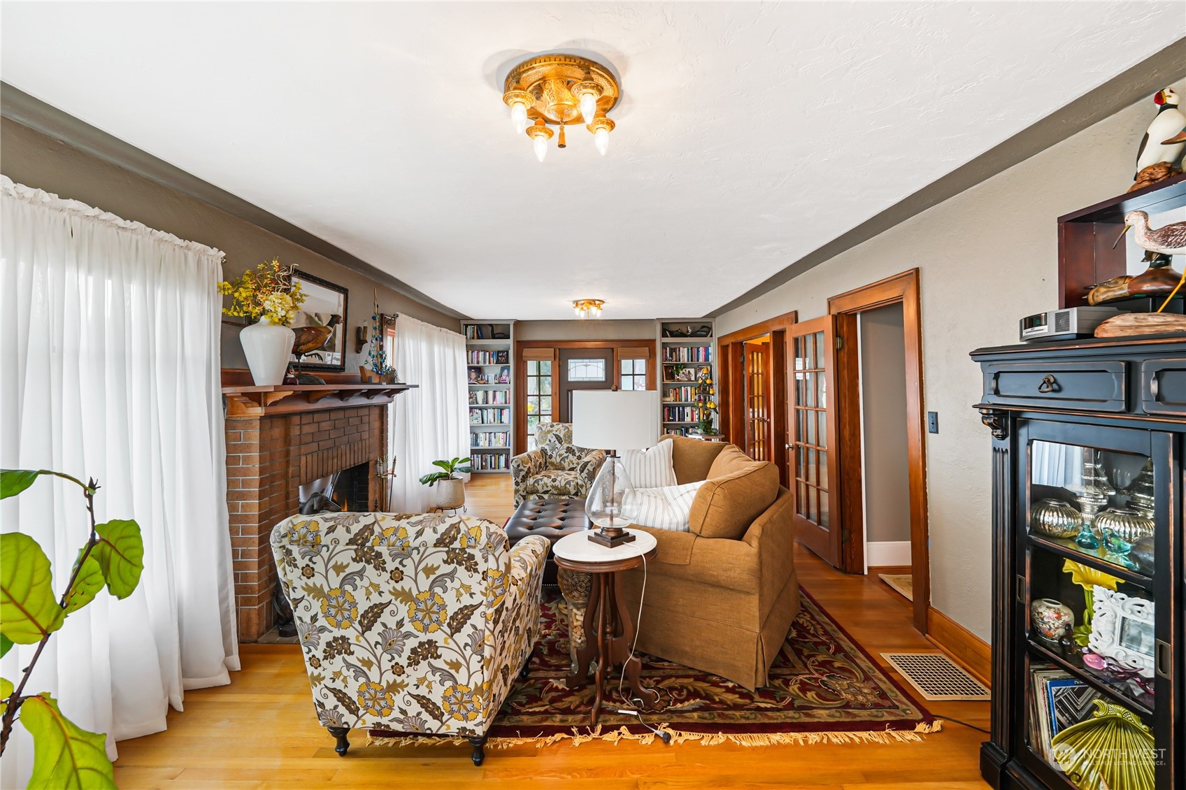 5918 Sunset Avenue Anacortes, WA 98221 - Photo 5 of 38 a living room with fireplace furniture and a flat screen tv