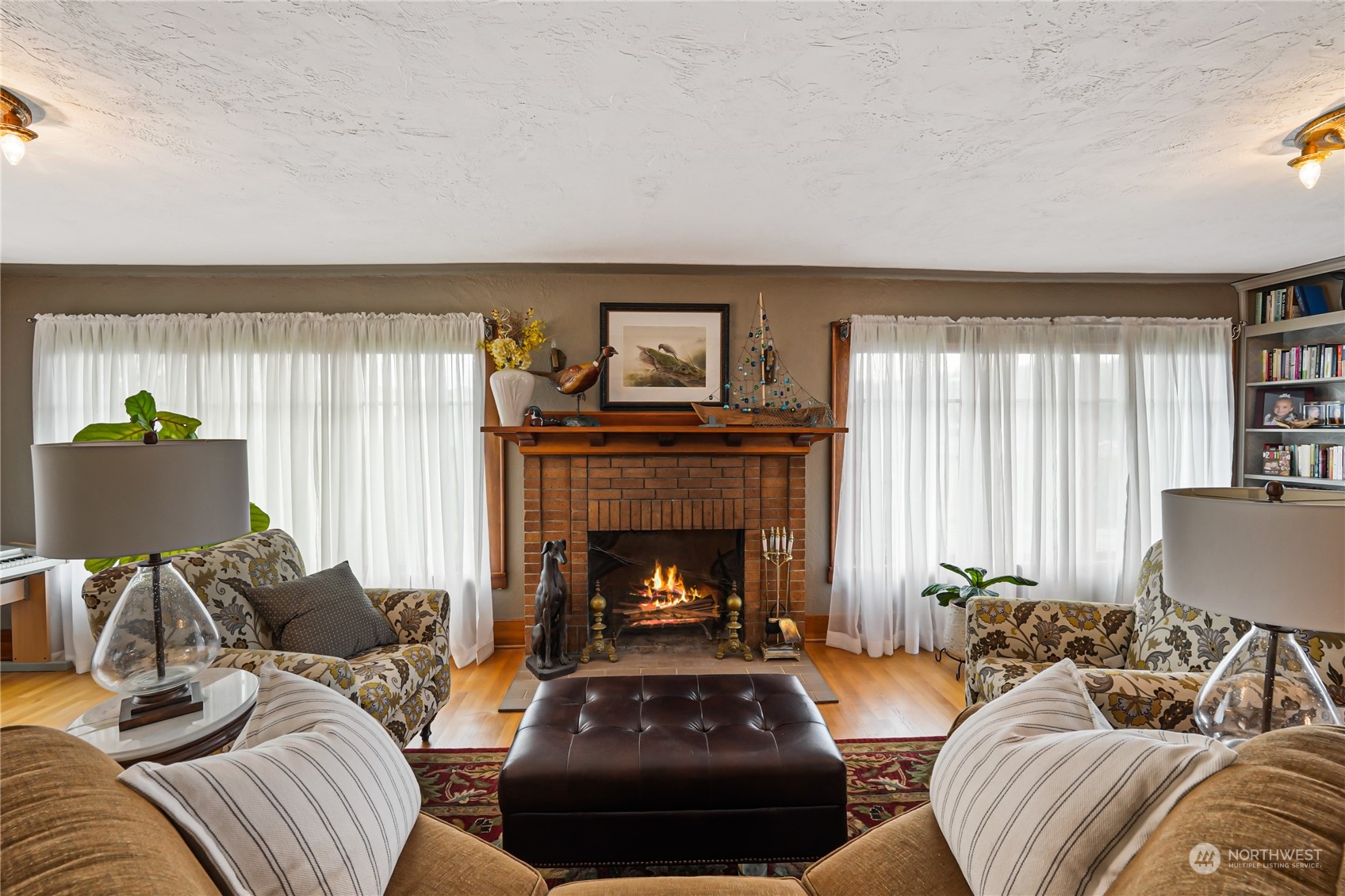 5918 Sunset Avenue Anacortes, WA 98221 - Photo 6 of 38 a living room with furniture and a fireplace
