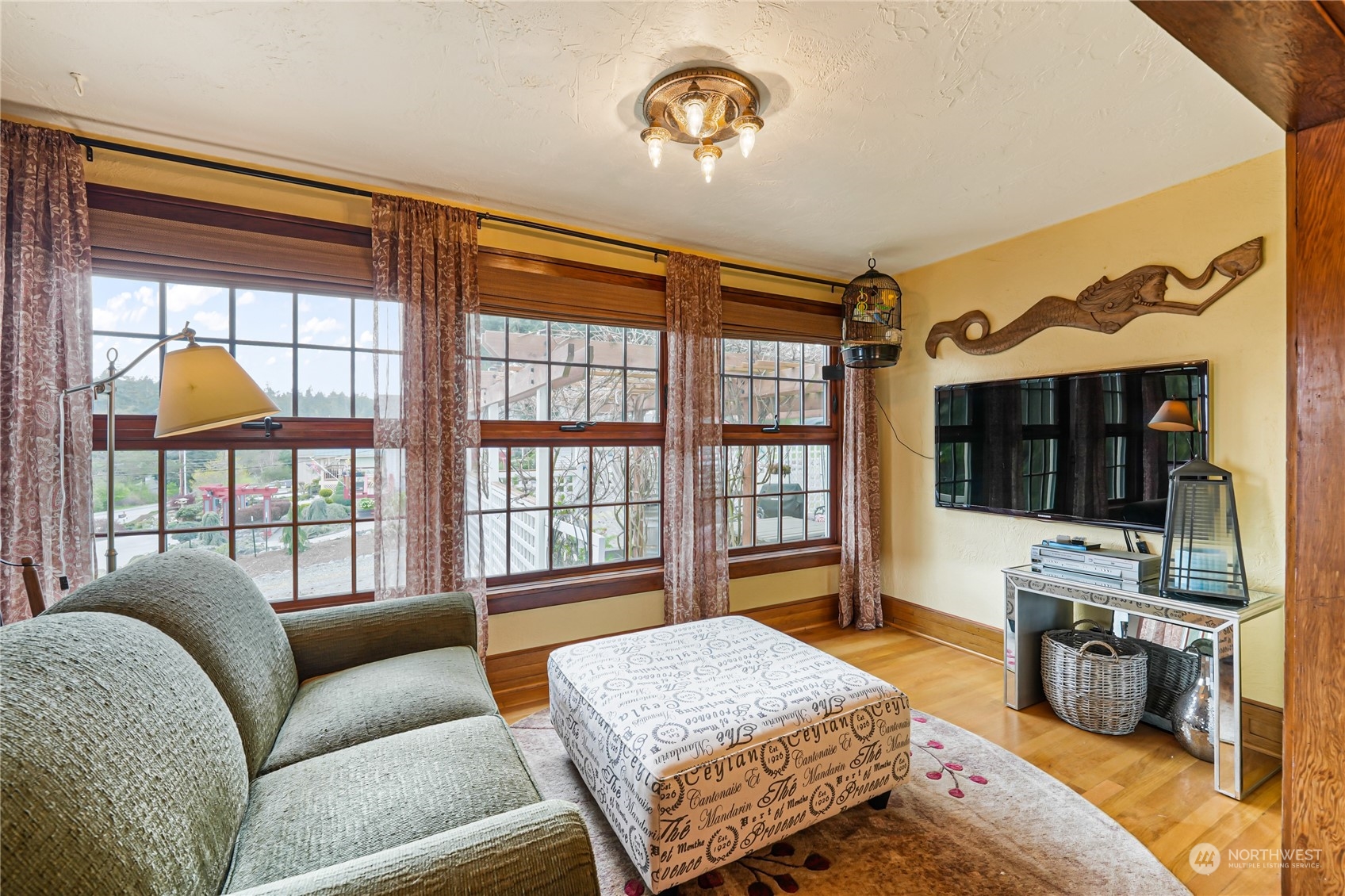 5918 Sunset Avenue Anacortes, WA 98221 - Photo 7 of 38 a bedroom with a bed and a flat screen tv