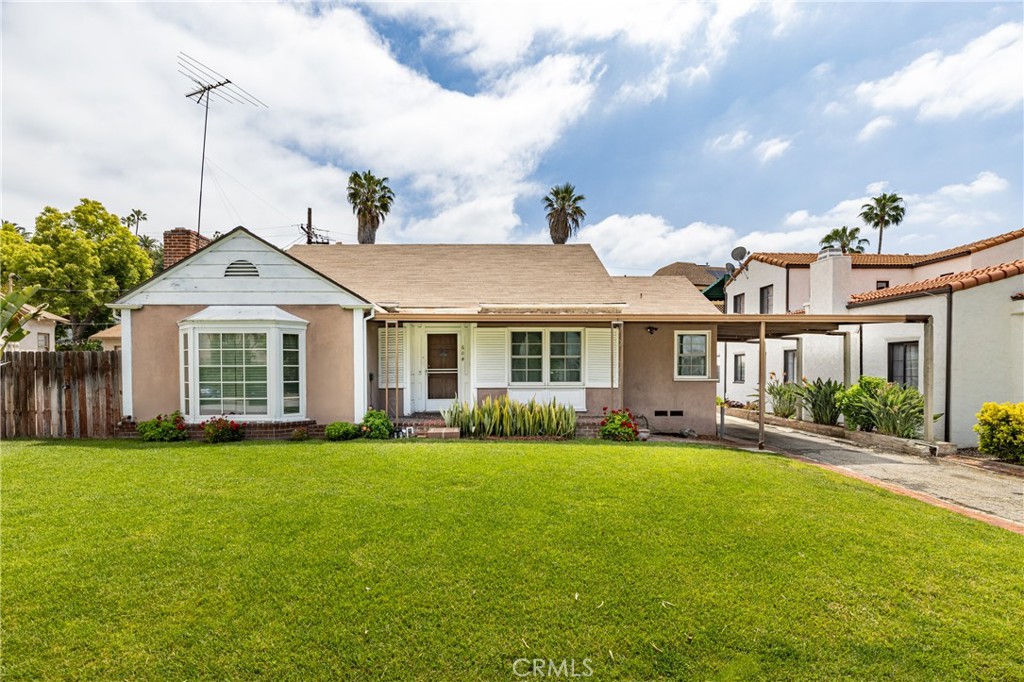 604 Grove Place Glendale, CA 91206 - Photo 1 of 30 a front view of a house with a garden and yard