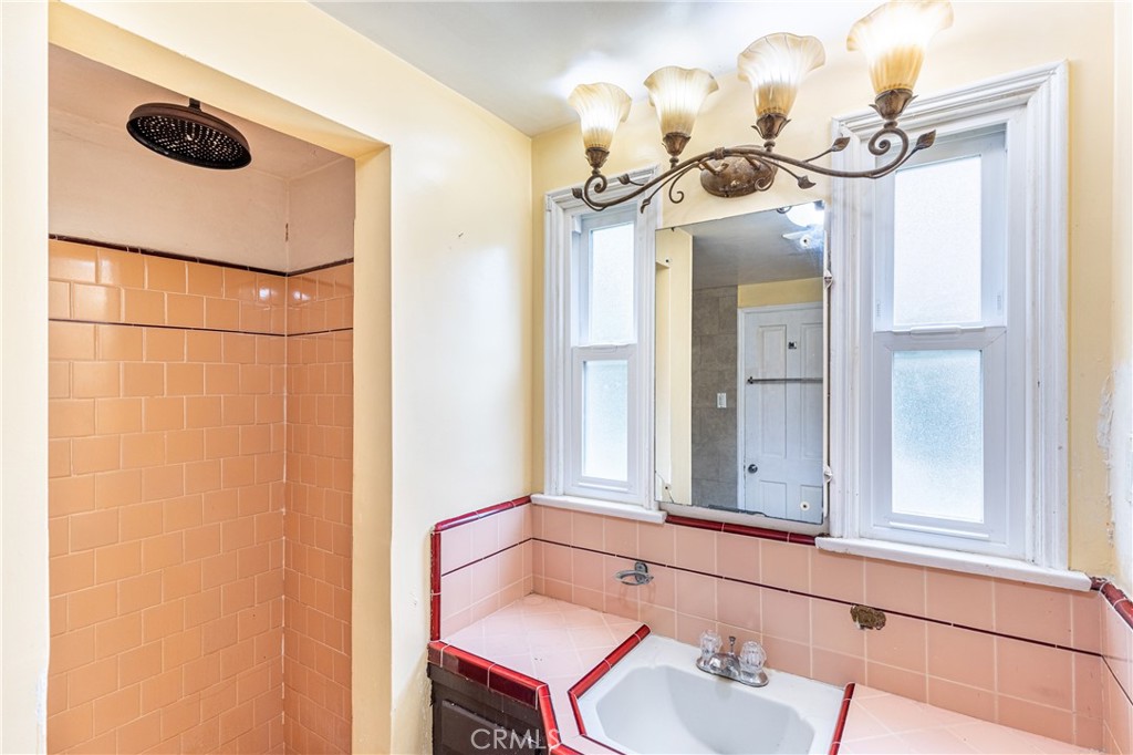 604 Grove Place Glendale, CA 91206 - Photo 11 of 30 a bathroom with a sink a mirror and a window