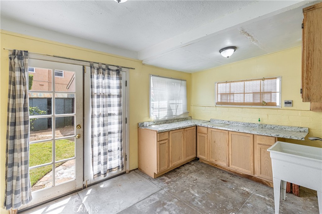 604 Grove Place Glendale, CA 91206 - Photo 13 of 30 a kitchen with granite countertop a sink and a stove