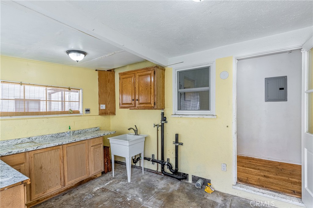 604 Grove Place Glendale, CA 91206 - Photo 14 of 30 a spacious bathroom with a granite countertop sink and a mirror