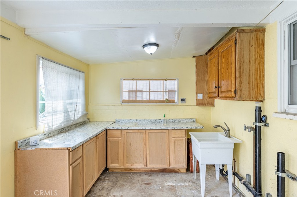 604 Grove Place Glendale, CA 91206 - Photo 15 of 30 a kitchen with granite countertop sink and cabinets
