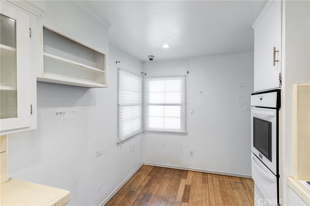 604 Grove Place Glendale, CA 91206 - Photo 19 of 30 a view of a kitchen with wooden floor and a sink