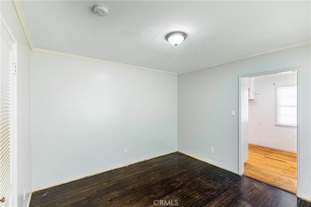 604 Grove Place Glendale, CA 91206 - Photo 21 of 30 an empty room with wooden floor and windows