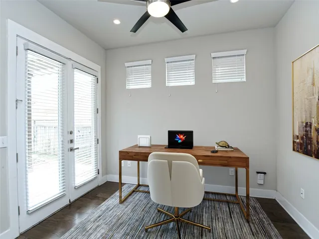a workspace with furniture window and wooden floor