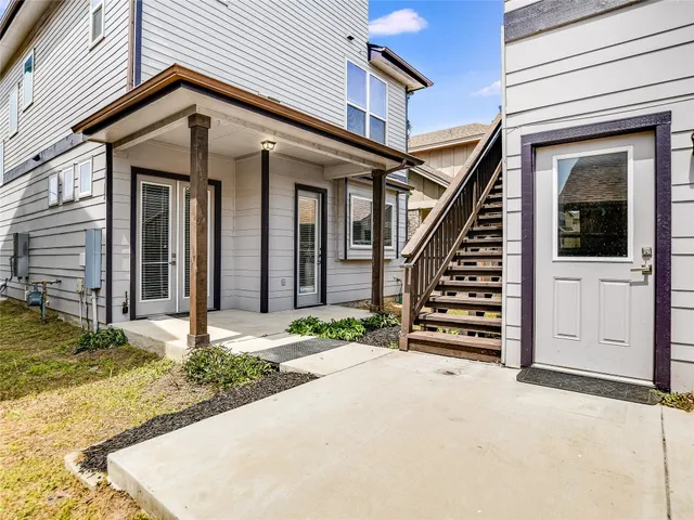 a view of a house with wooden floor and fence