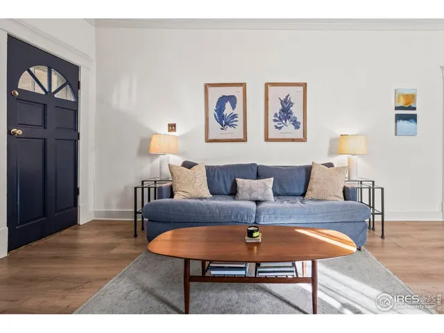 a living room with a fireplace and a flat screen tv