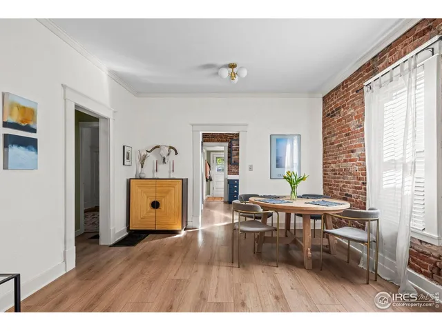 a view of living room with a sink and mirror