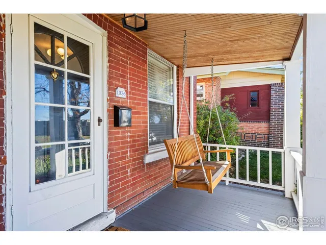a view of a chair and table in the balcony