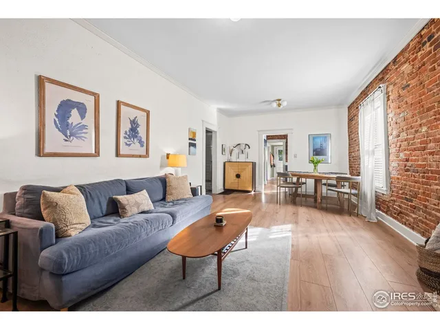 a living room with furniture fireplace and flat screen tv
