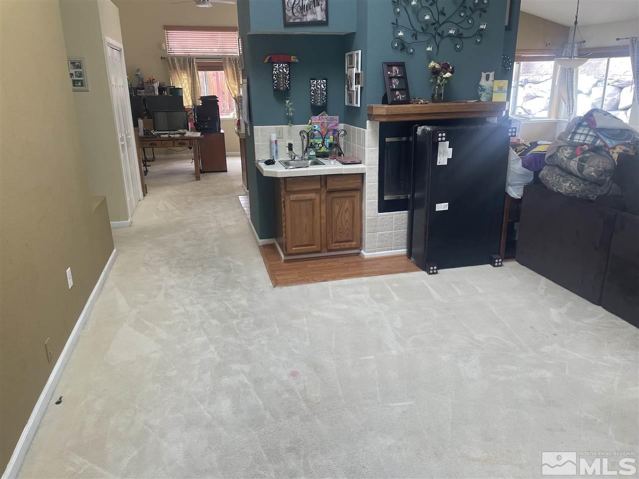 1545 Grand Point Way Reno, NV 89523 - Photo 3 of 12 a view of living room and kitchen with furniture
