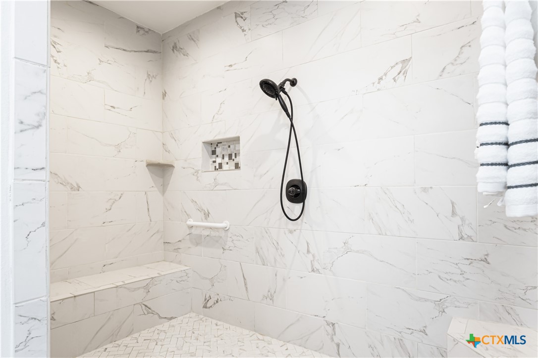 790 Spanish Grant Road Goliad, TX 77963 - Photo 19 of 41 a bathroom with a shower