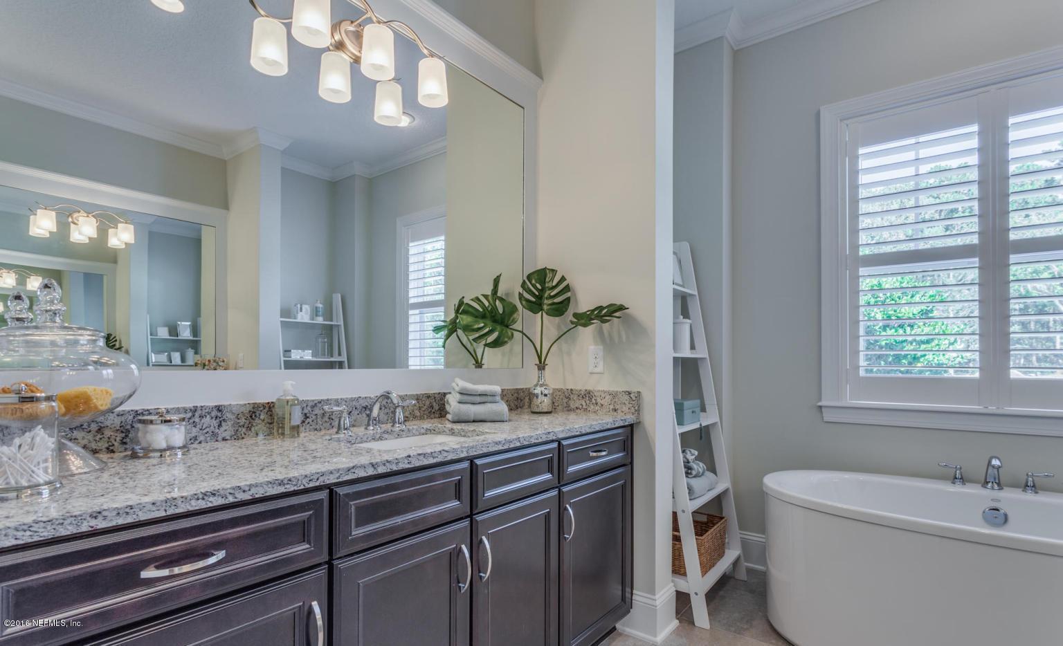 Lot 2 Brady Road Jacksonville, FL 32223 - Photo 14 of 20 a bathroom with a granite countertop sink a large mirror and a bathtub