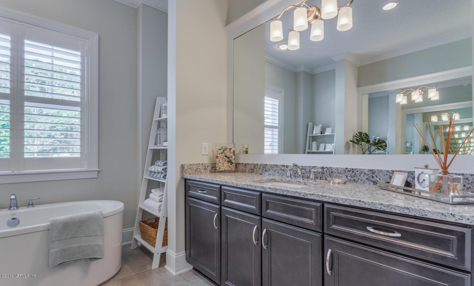 Lot 2 Brady Road Jacksonville, FL 32223 - Photo 15 of 20 a bathroom with a granite countertop sink a large mirror a bathtub and window
