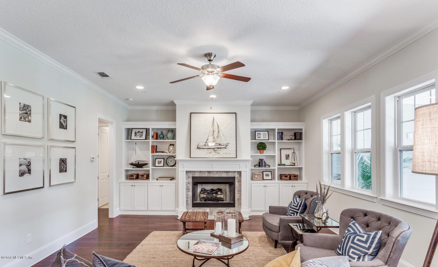 Lot 2 Brady Road Jacksonville, FL 32223 - Photo 7 of 20 a living room with furniture chandelier and a fireplace