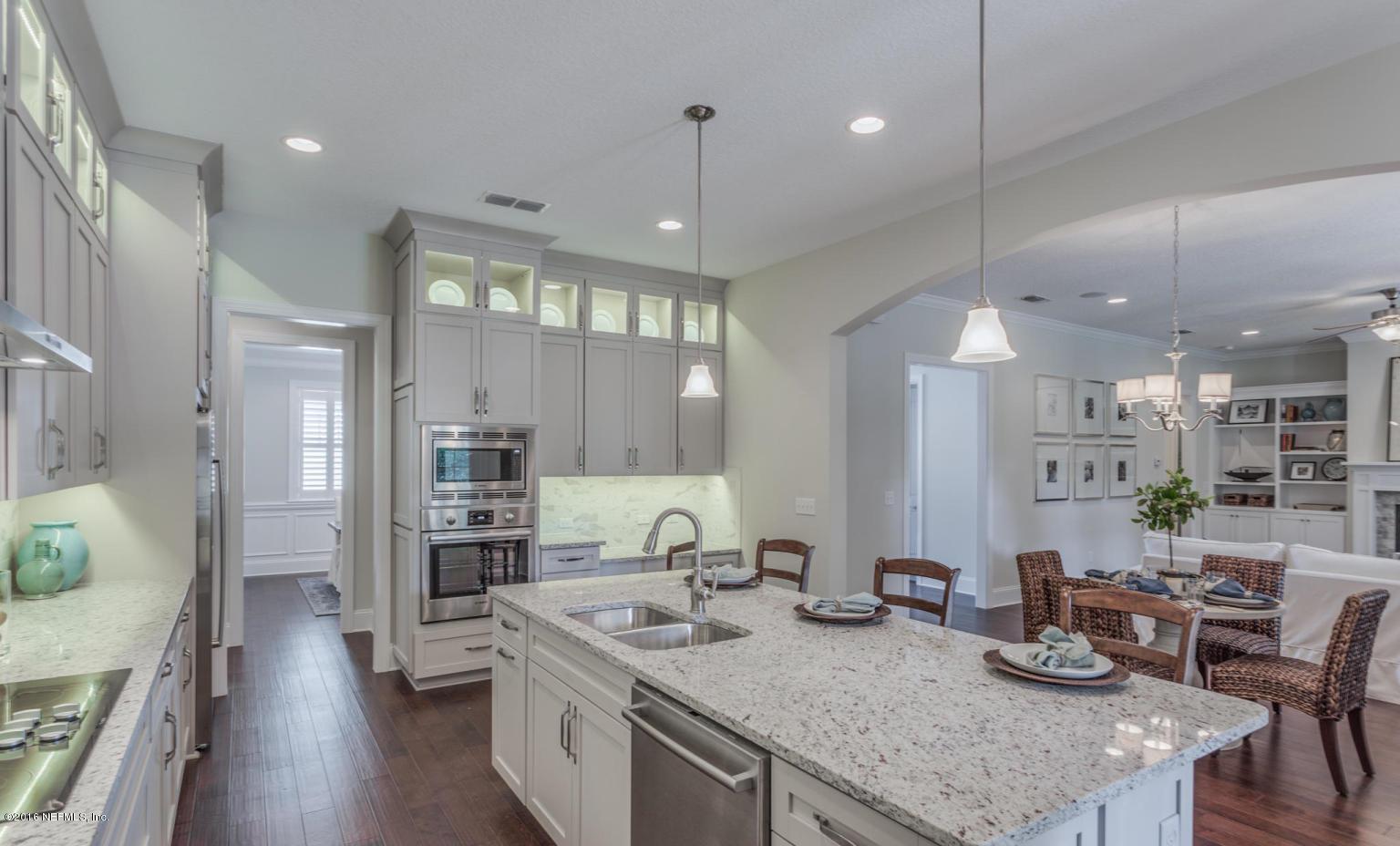 Lot 2 Brady Road Jacksonville, FL 32223 - Photo 9 of 20 a kitchen with granite countertop a table chairs stainless steel appliances and wooden floor
