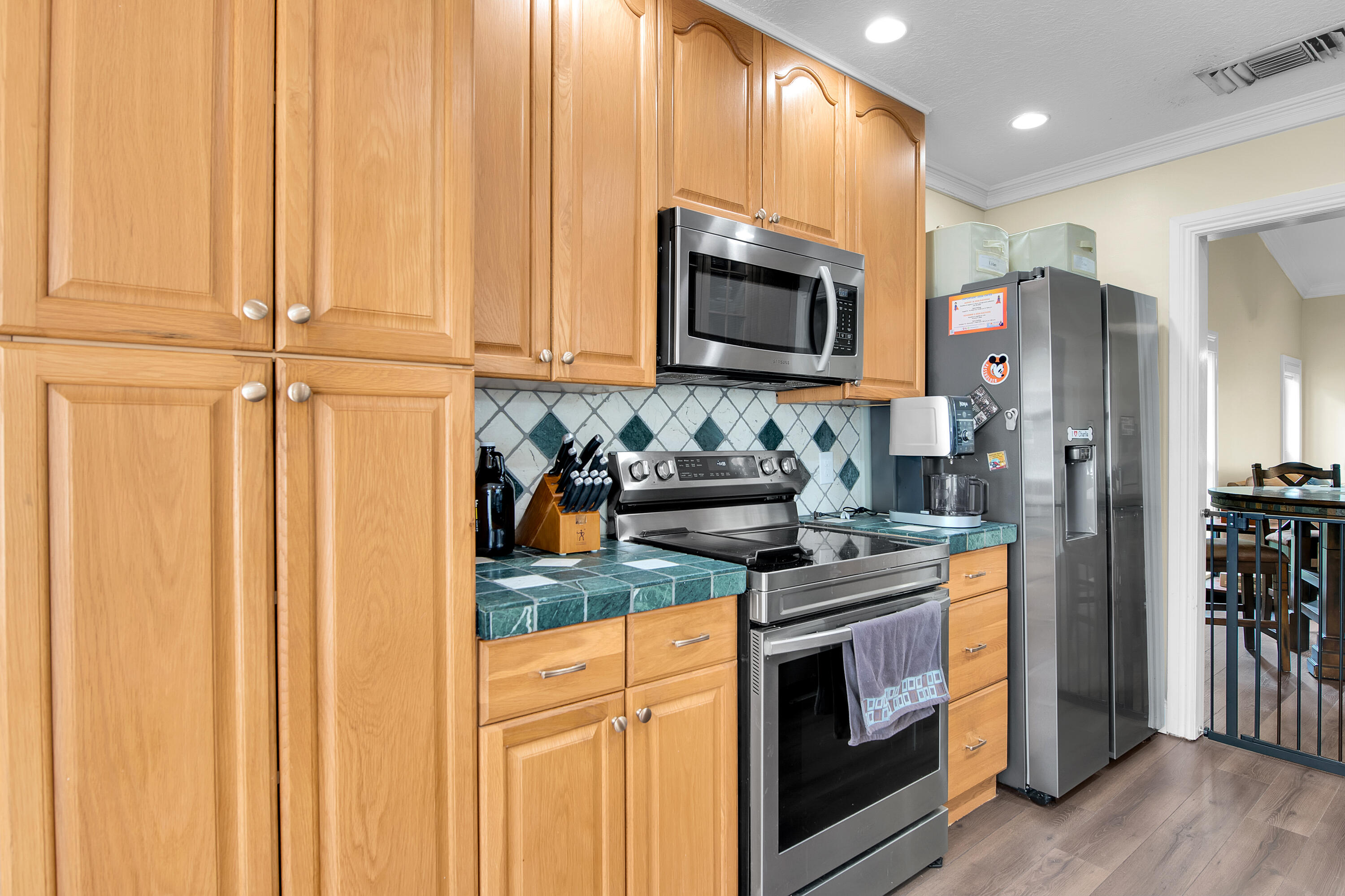 8203 Northwest 100th Way Tamarac, FL 33321 - Photo 11 of 31 a kitchen with stainless steel appliances granite countertop a refrigerator stove and sink