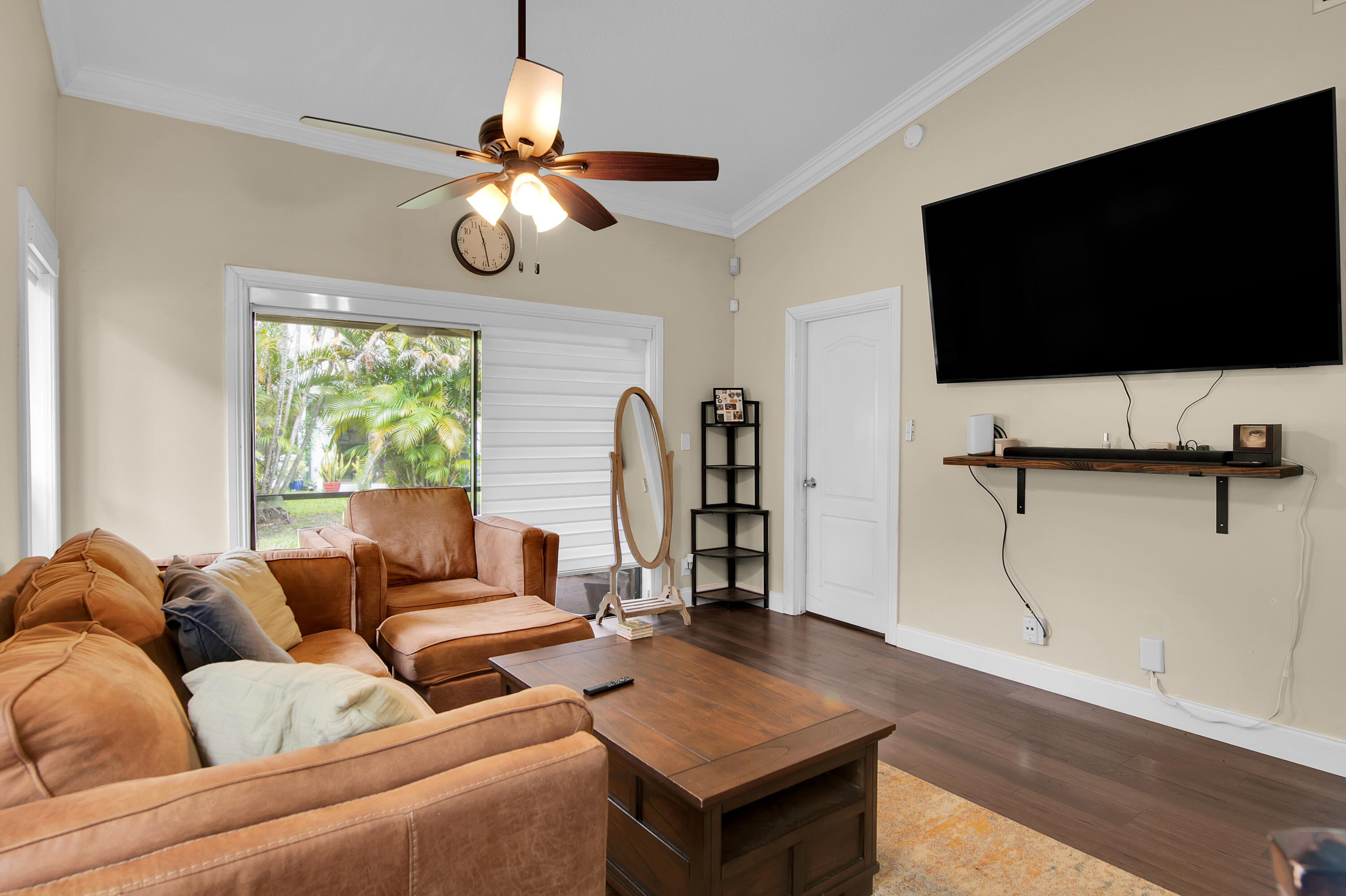 8203 Northwest 100th Way Tamarac, FL 33321 - Photo 13 of 31 a living room with furniture and a flat screen tv