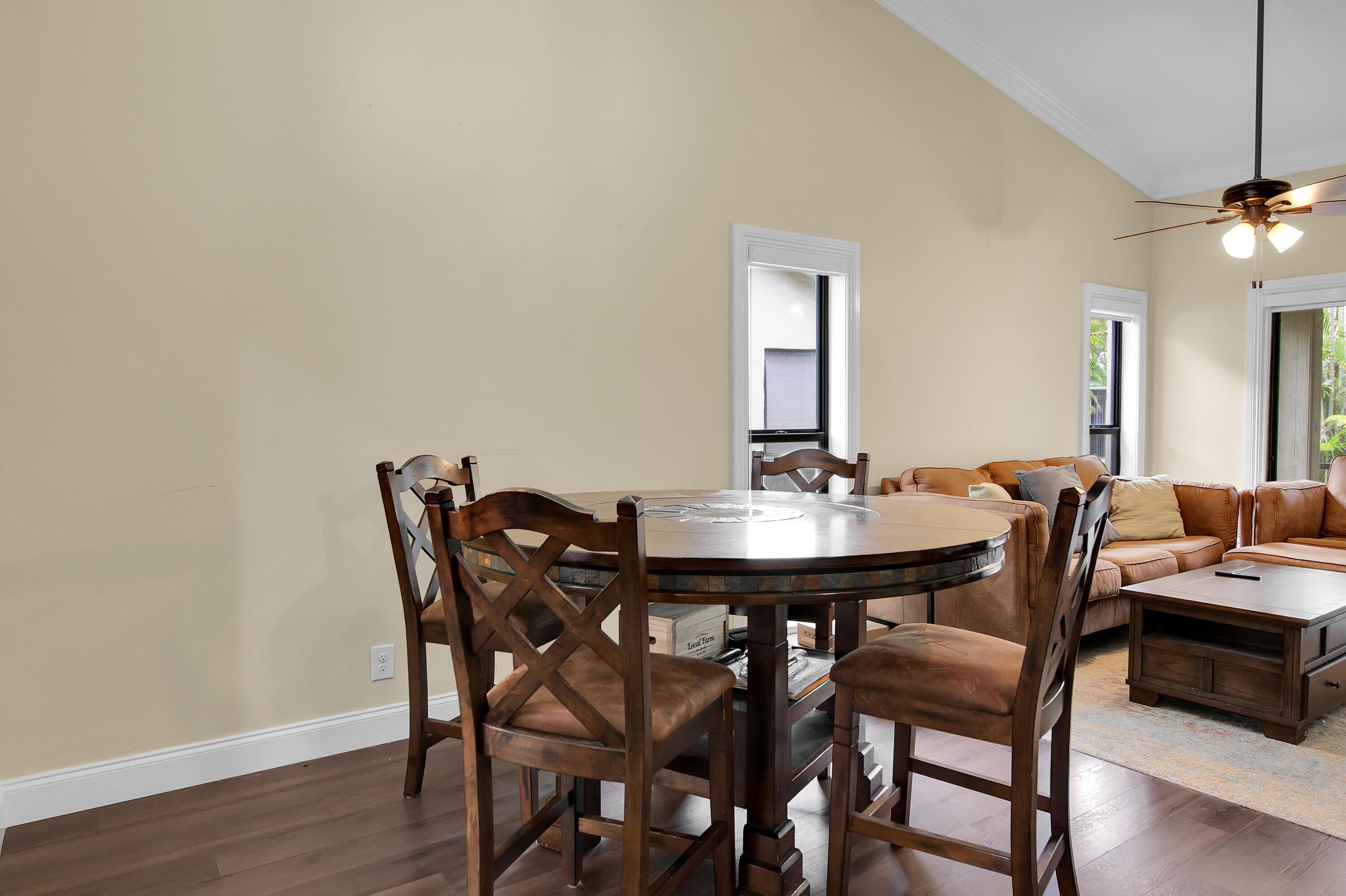 8203 Northwest 100th Way Tamarac, FL 33321 - Photo 15 of 31 a view of a dining room with furniture and wooden floor