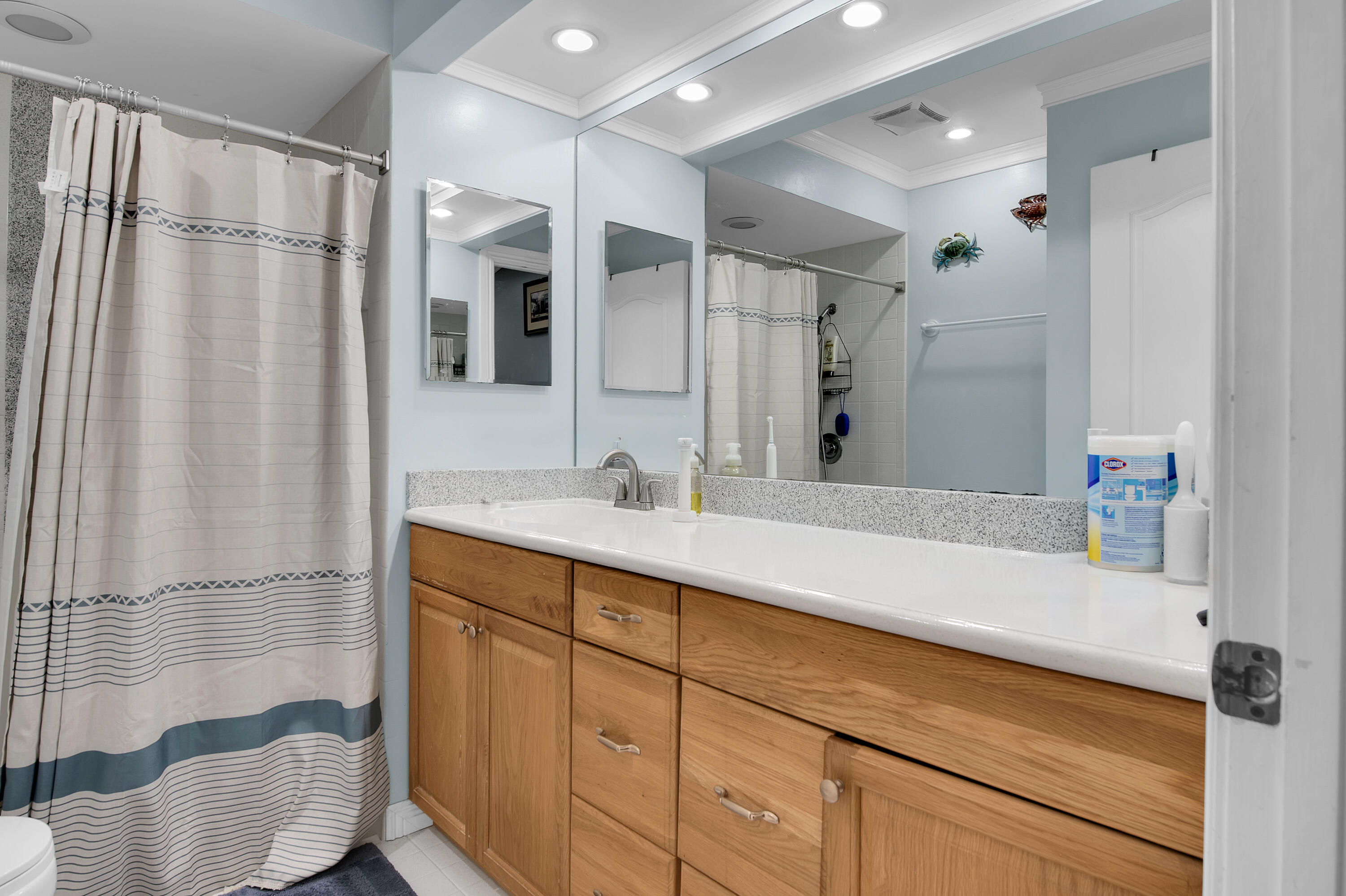 8203 Northwest 100th Way Tamarac, FL 33321 - Photo 19 of 31 a bathroom with a double vanity sink mirror and shower