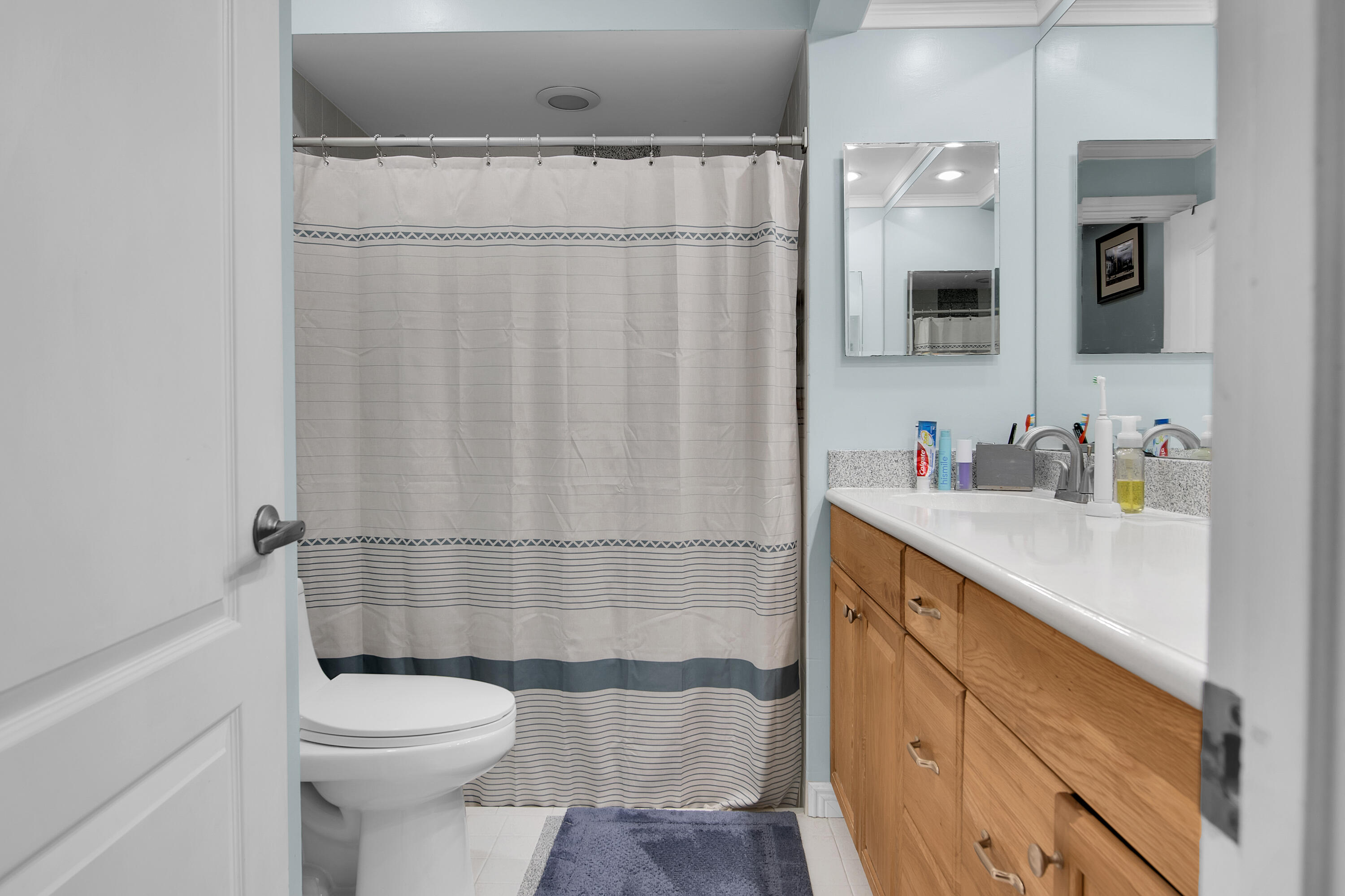 8203 Northwest 100th Way Tamarac, FL 33321 - Photo 20 of 31 a bathroom with a sink a toilet and shower