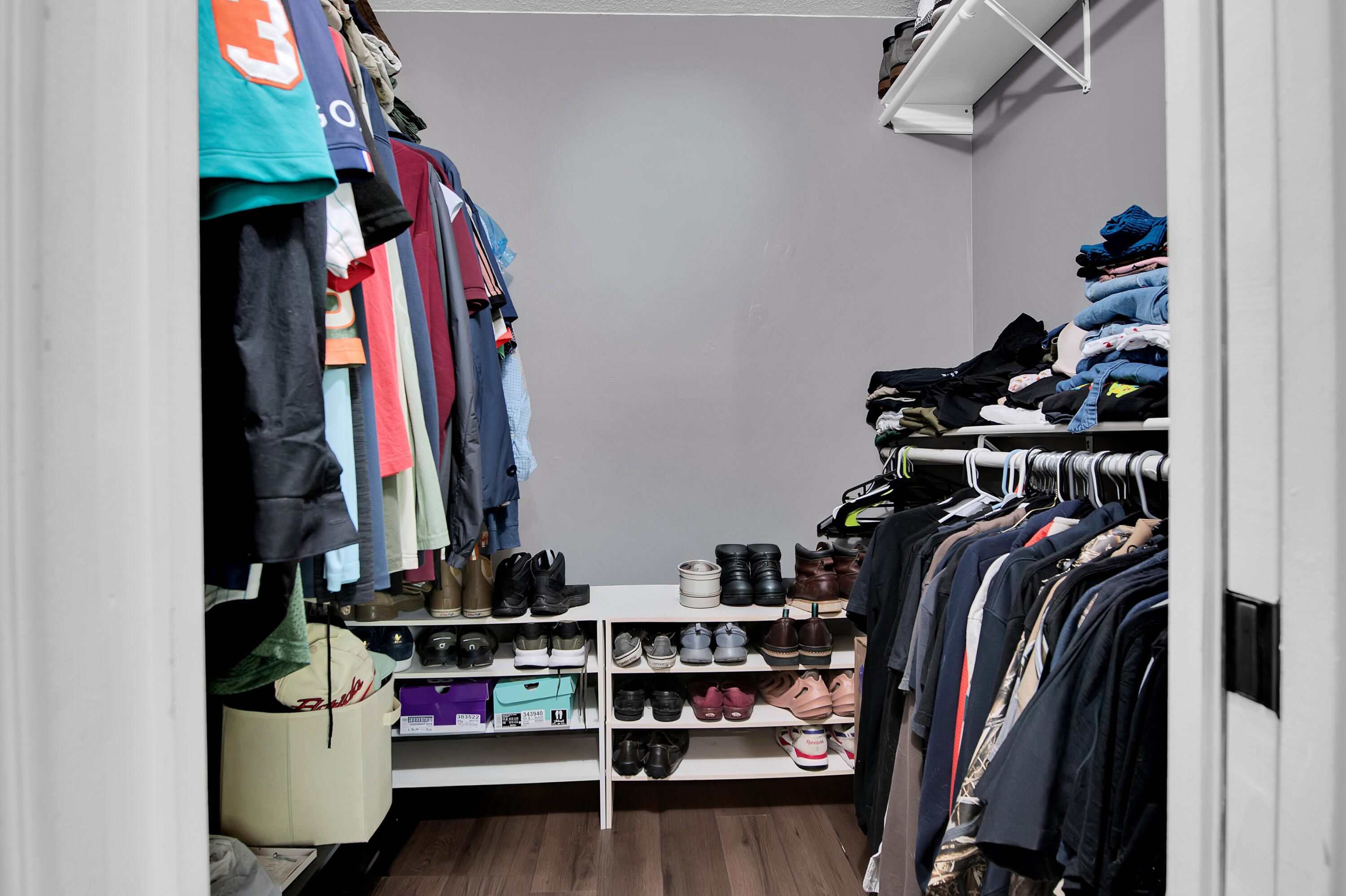 8203 Northwest 100th Way Tamarac, FL 33321 - Photo 22 of 31 a view of walk in closet with clothes and shoes