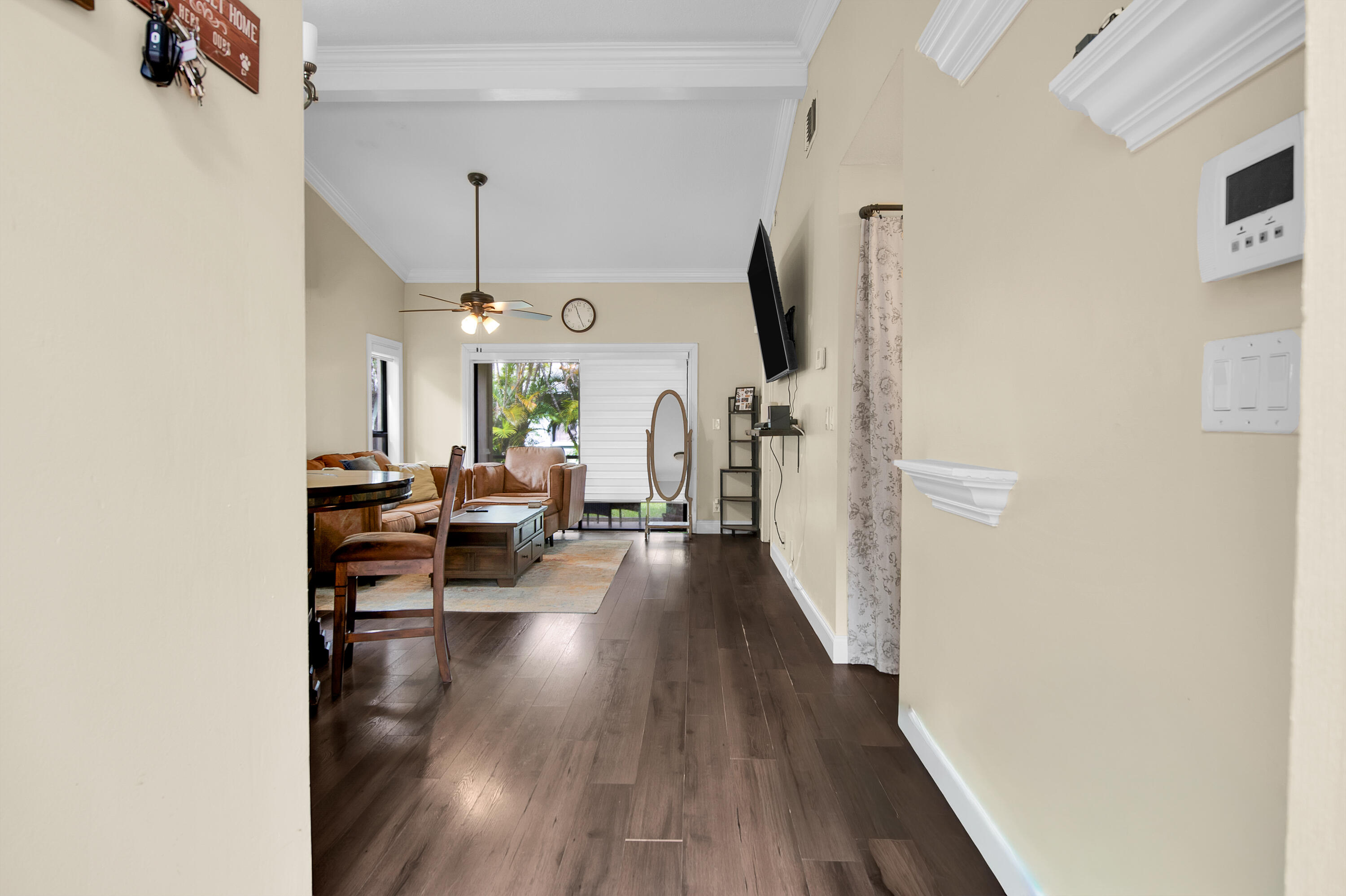 8203 Northwest 100th Way Tamarac, FL 33321 - Photo 24 of 31 a living room with furniture and a flat screen tv