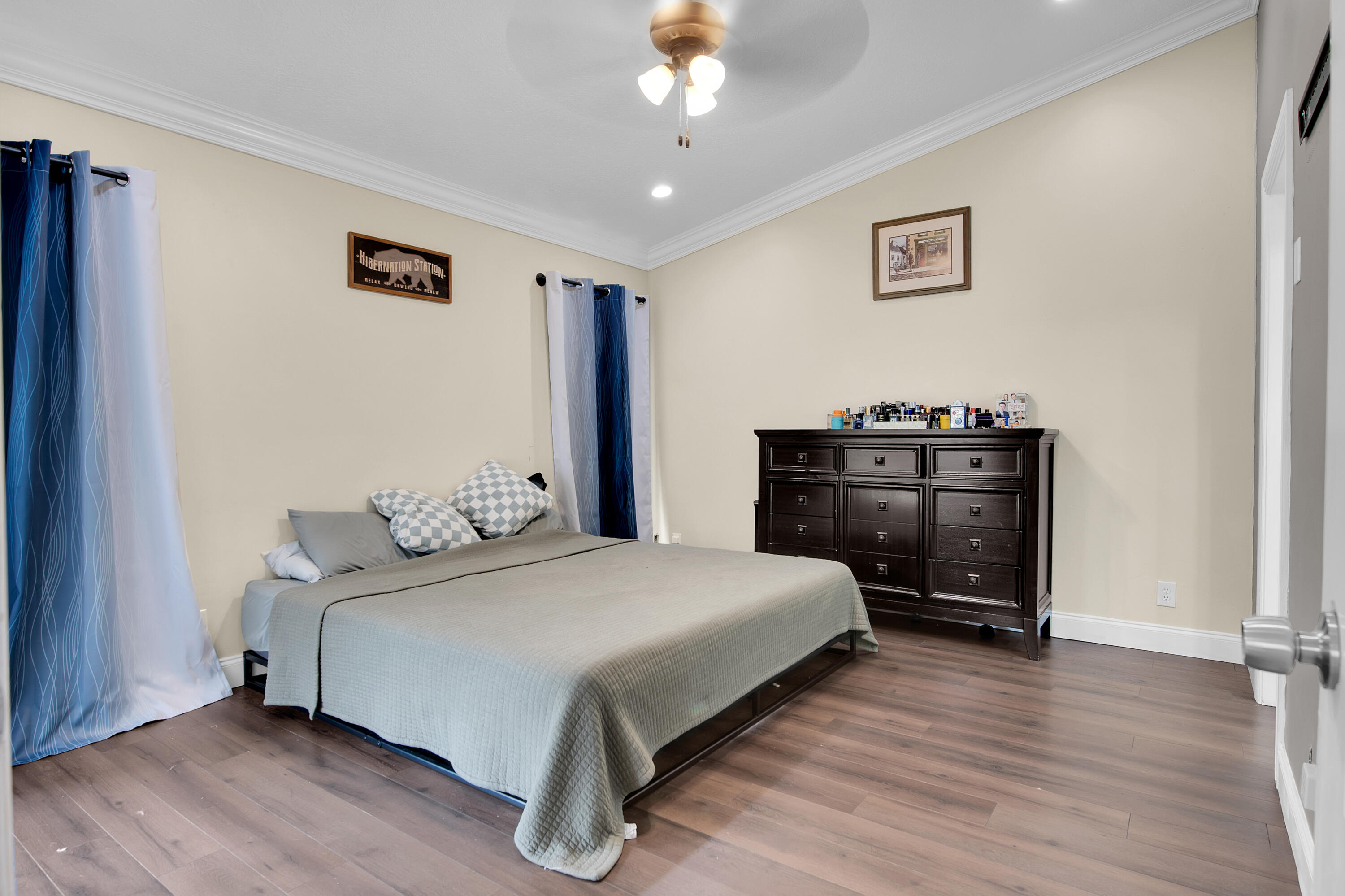 8203 Northwest 100th Way Tamarac, FL 33321 - Photo 25 of 31 a bedroom with a bed and dresser