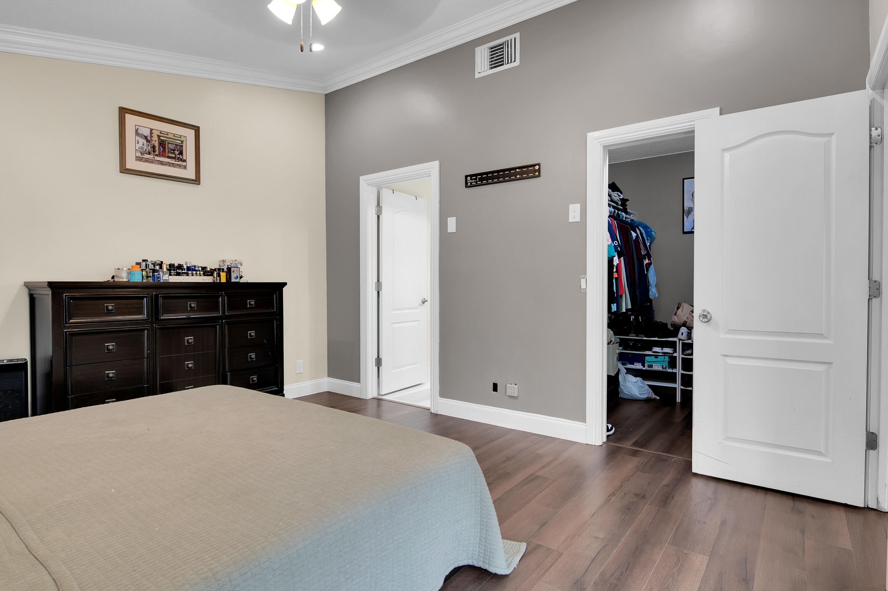 8203 Northwest 100th Way Tamarac, FL 33321 - Photo 26 of 31 a bedroom with a bed and a dresser