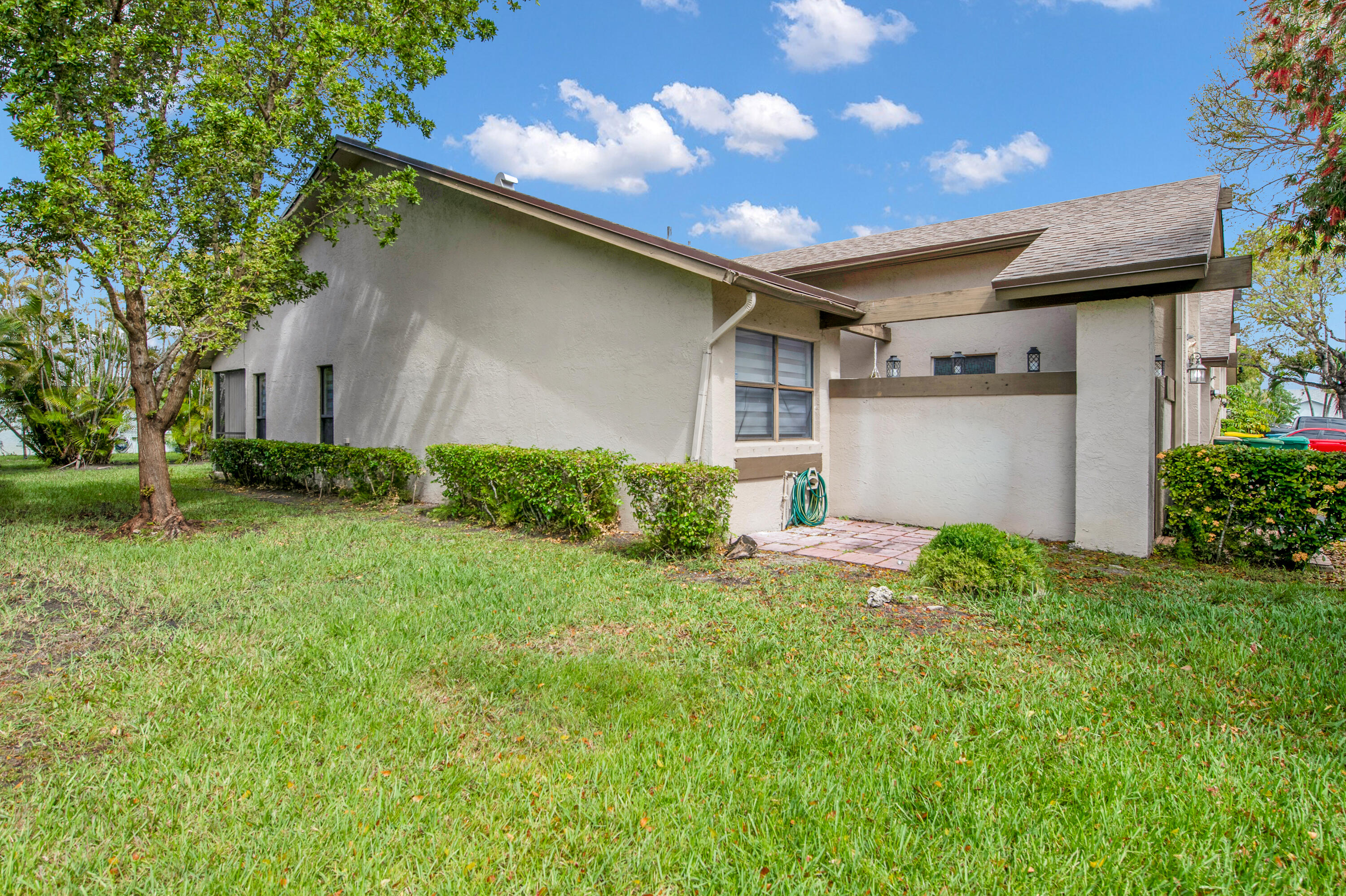 8203 Northwest 100th Way Tamarac, FL 33321 - Photo 6 of 31 a front view of house with yard and trees